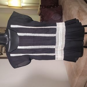 Black 100% cotton with off white embroidery